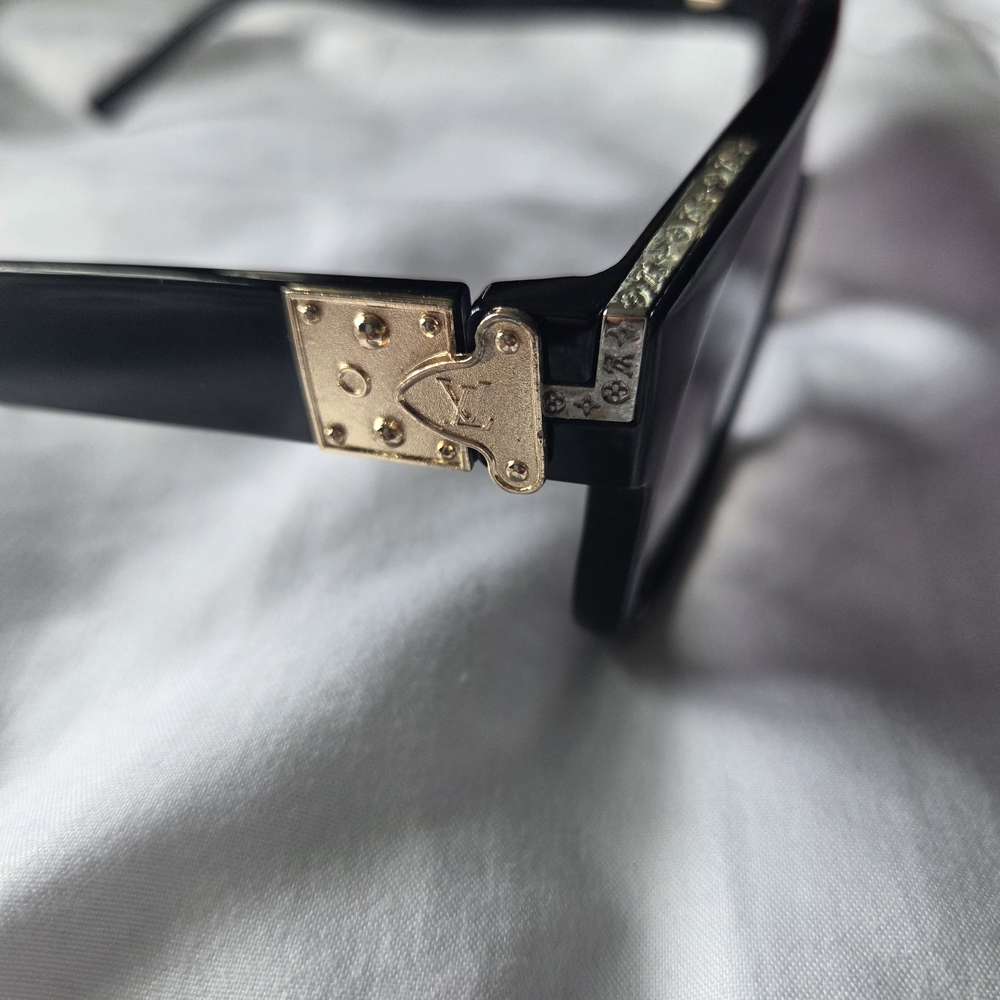 Louis Vuitton Black and Gold Glasses with Intricate Hinge